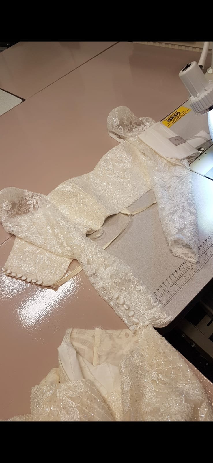 Bespoke gown fabric, lace and dressmaking detail 11